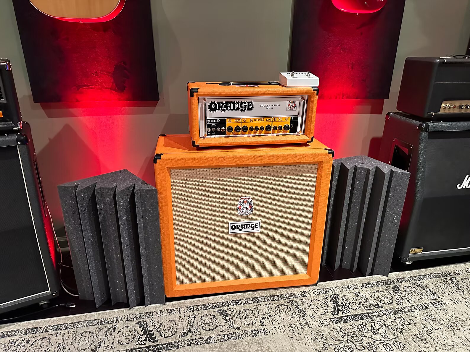 Live room with guitars and amp stacks